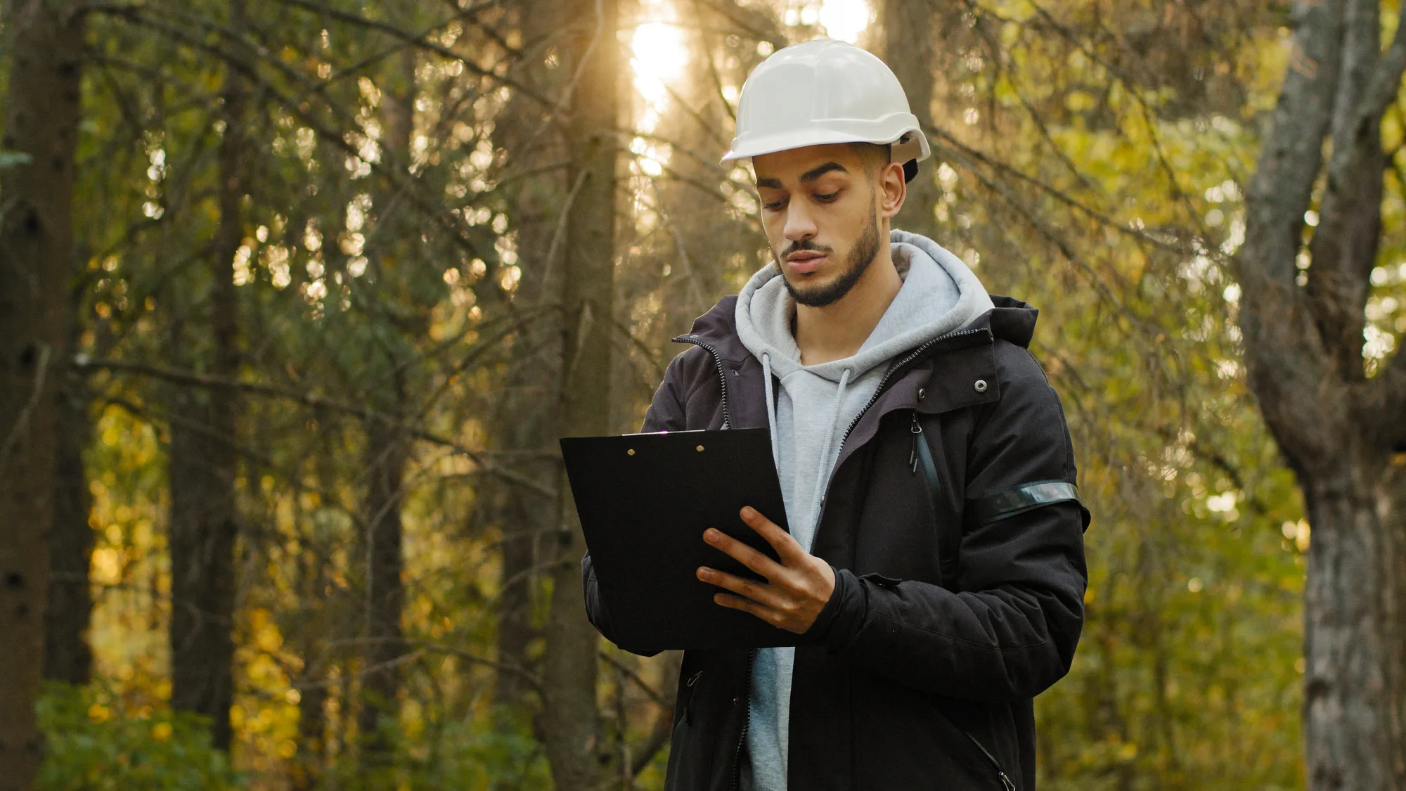 pest control working with ipad in forest